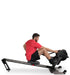 Ropeflex RX3200 ADDAX Rowing Rope Trainer - A man sitting on a gym machine while pulling a rope