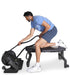 Ropeflex RXB2 Flat Bench - A man in a blue shirt is half-kneeling on a flat bench while pulling a rope in a gym machine