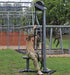 Ropeflex RX5500 Oryx 2 Outdoor Vertical Rope Trainer - A military personnel is using an outdoor fitness machine to exercise