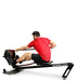 Ropeflex RX3200 ADDAX Rowing Rope Trainer - A man wearing a red shirt is sitting on a machine while trying to pull a rope