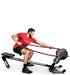 Ropeflex RX3200 ADDAX Rowing Rope Trainer - A man in a squat position is pulling a rope from a fitness machine