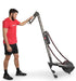 Ropeflex RX3200 ADDAX Rowing Rope Trainer - A man standing next and holding a rope machine