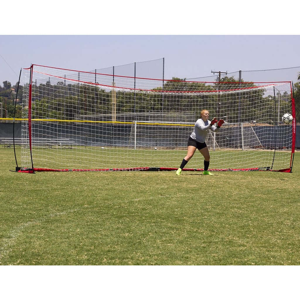 A goal keeper with Powernet Soccer Goal Regulation Size 24x8 Net S007 in the background
