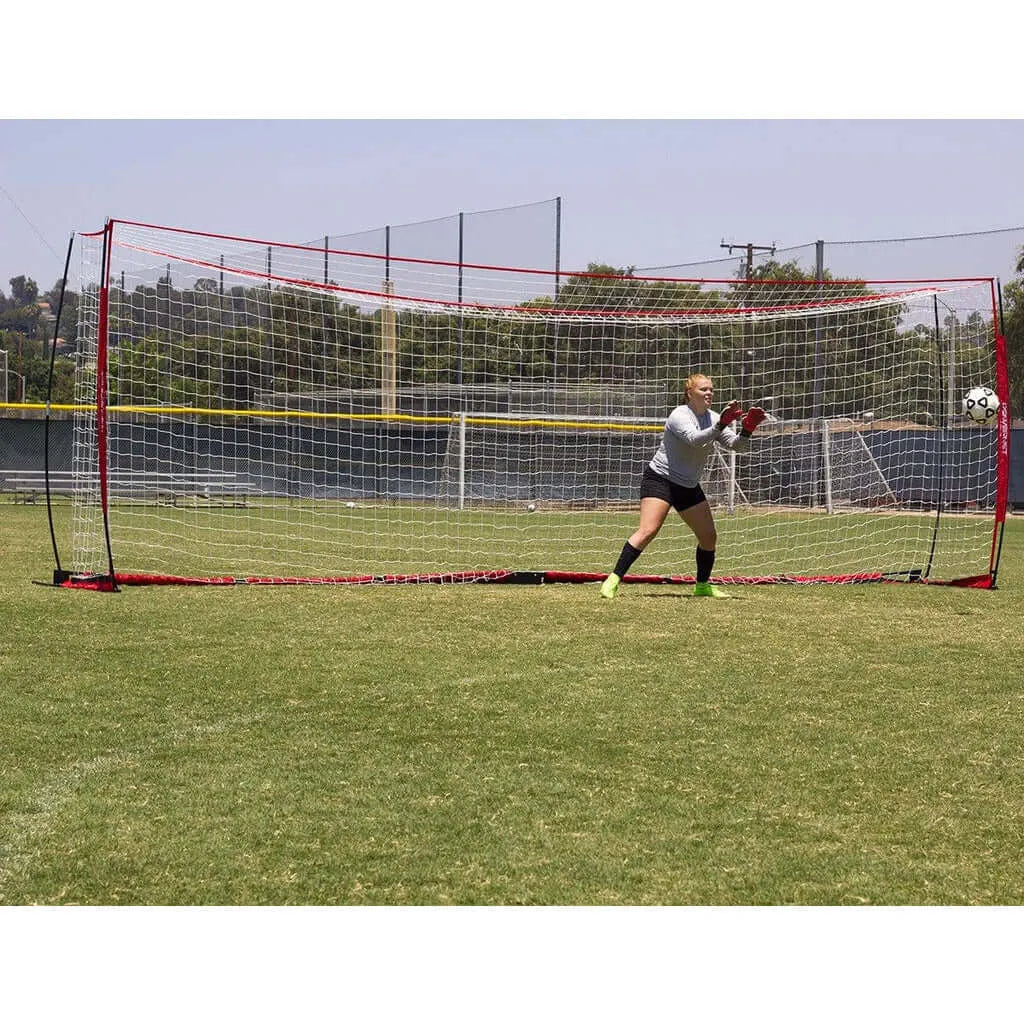 A goal keeper with Powernet Soccer Goal Regulation Size 24x8 Net S007 in the background