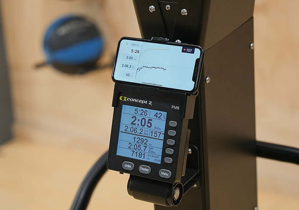 Skierg Concept 2 performance monitor displaying workout metrics and mobile app connection.