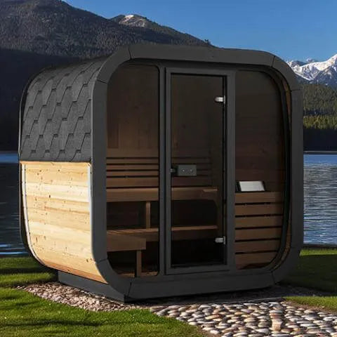 SaunaLife Model CL5G Outdoor Home Sauna - Outdoor sauna with a wooden and black exterior set against a lake and mountains.