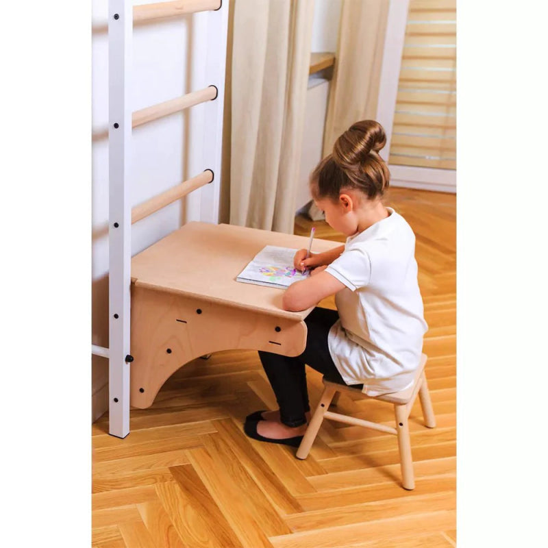 BenchK Pull-up Bar BT076M - A girl using the bar for writing while sitting on her chair