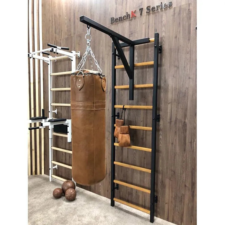 BenchK Punching Bag Holder - Side view photo of black holder attached to wall bar with brown punching bag