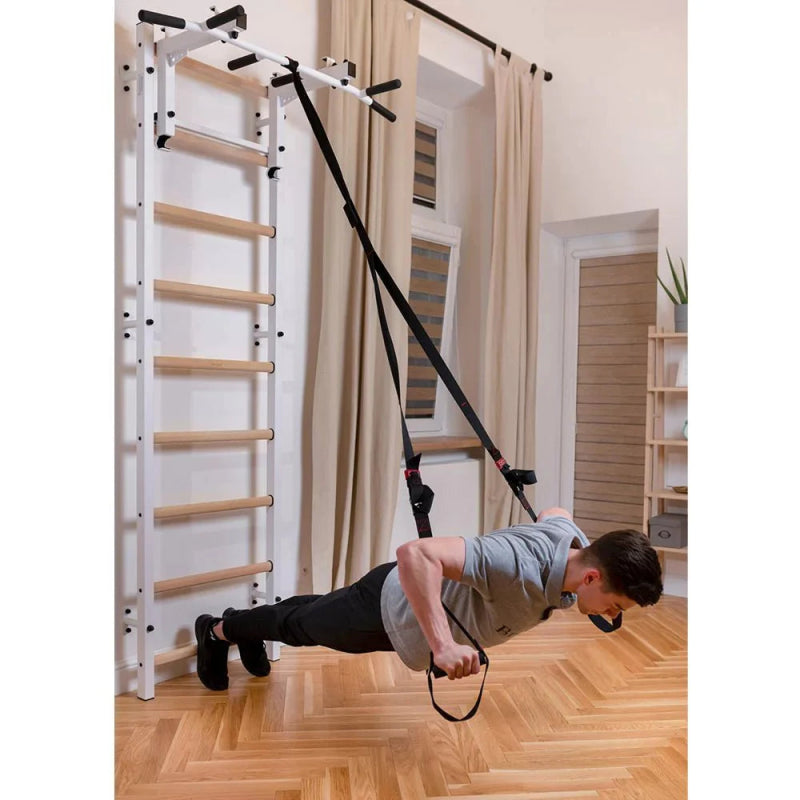 BenchK Stall Bar 732B - Man holding up black straps exercise