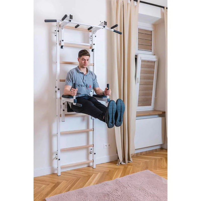 BenchK Stall Bar 732B - Side view photo of man working out with leg raise in dip bar equipment