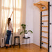 BenchK Stall Bars 711B - Actual product photo in a living room with a woman moving the curtains