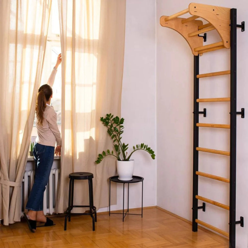 BenchK Stall Bars 711B - Actual product photo in a living room with a woman moving the curtains