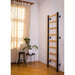 BenchK Wall Bars 700B/700W - in black color placed in a living room