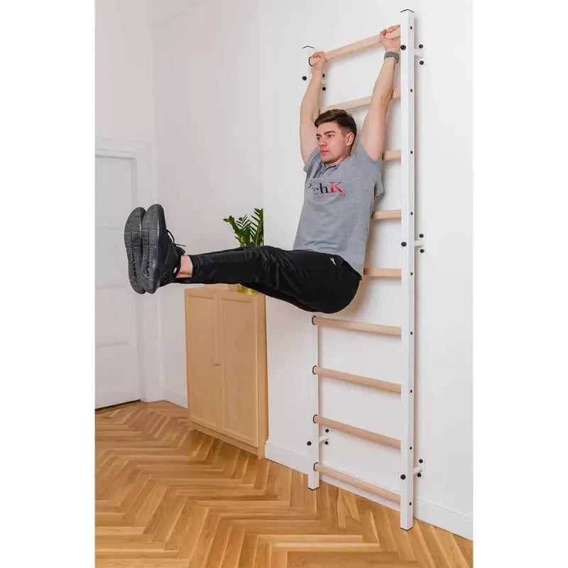 BenchK Wall Bars 700B/700W - man working out on leg raise while two hands holding the bar
