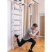 BenchK Wall Bars 731B - a man working out one leg kneeling down