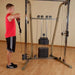 Best Fitness BFFT10R Functional Trainer - man standing having arms and chest exercise