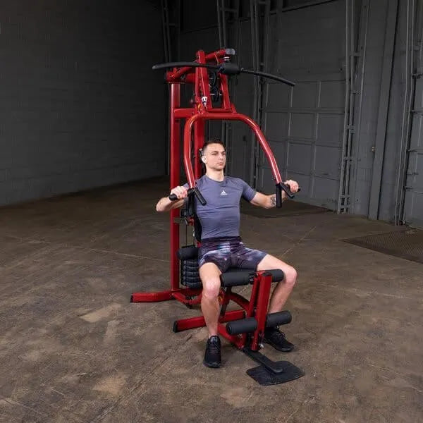 Best Fitness BFMG30 Multi Station Gym - man sitting holding the actual product to workout