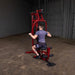 Best Fitness BFMG30 Multi Station Gym - man sitting in front and holding pull up bars/station