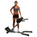 Body-Solid 45° Back Hyperextension GHYP345 - Woman standing while touching GHYP345