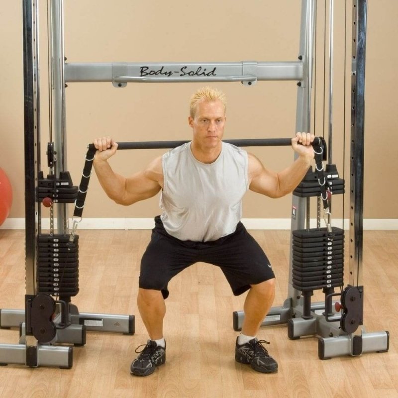 Body-Solid Bar Attachment GDCCBAR - Man trying to lift weights attached to bar attachment