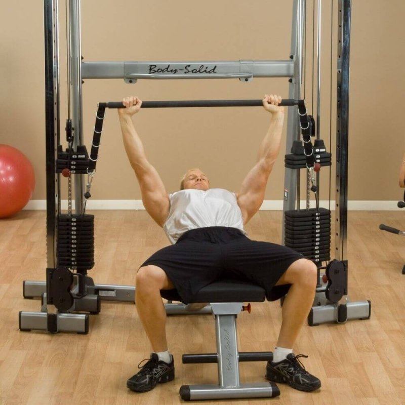 Body-Solid Bar Attachment GDCCBAR - Man laying down while lifting weights attached to bar attachment