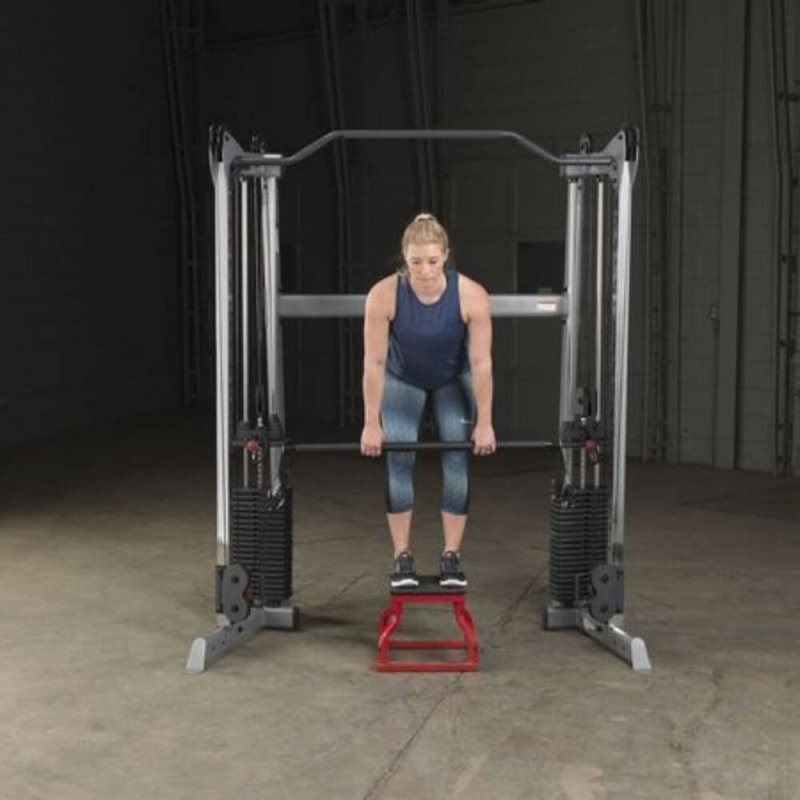 Body-Solid Bar Attachment GDCCBAR - Woman standing on a small red chair