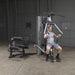 Body-Solid Bi-Angular Multi-Stack Gym G10B - Man sitting working out