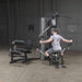 Body-Solid Bi-Angular Multi-Stack Gym G10B - Man sitting doing bicep workout