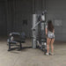 Body-Solid Bi-Angular Multi-Stack Gym G10B - Female model standing in front of multi stack gym