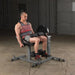 Body-Solid Cam Series Leg Extension and Curl GCEC340 - Man sitting