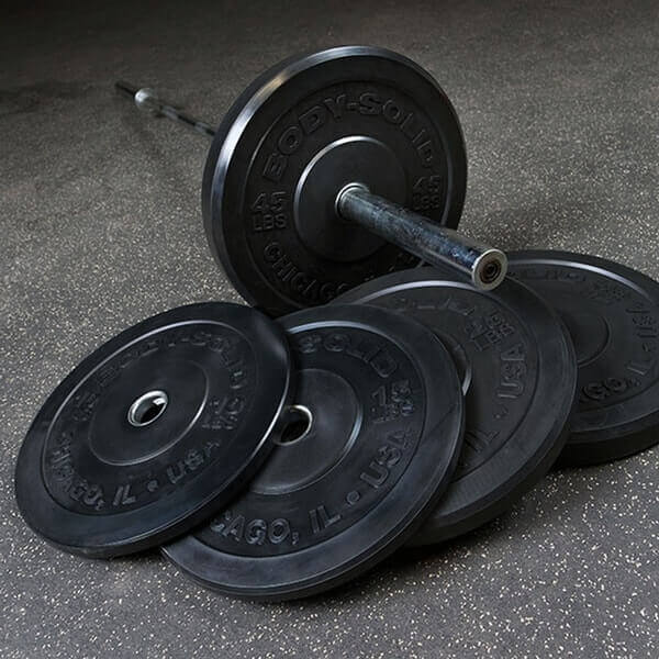 Body-Solid Chicago Extreme Bumper Plates OBPX - one weight in a barbell bell - and 4 weights in floor