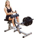 Body-Solid Commercial Seated Calf Raise GSCR349 - Woman sitting on the product 