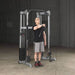 Body-Solid Compact Functional Training Center GDCC210 - front delt exerise with man standing in front of the product