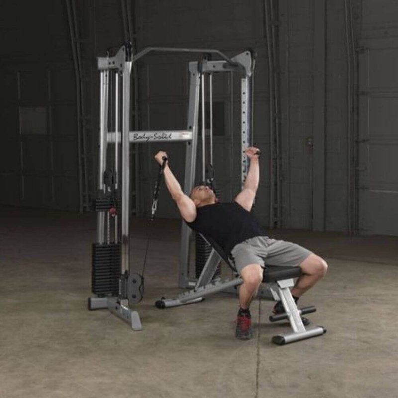 Body-Solid Compact Functional Training Center GDCC210 - Man on bench doing chest fly workout