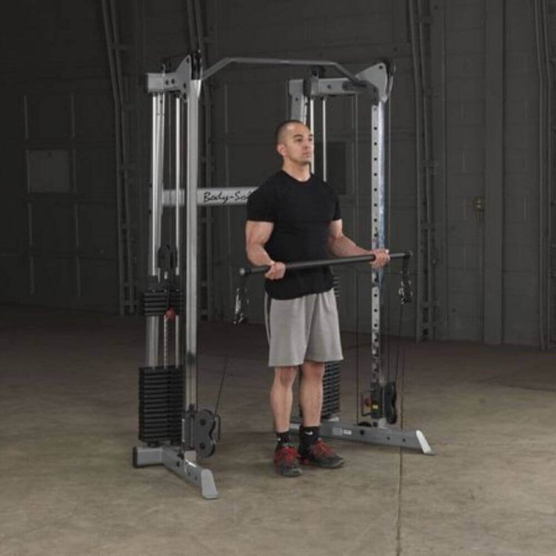 Body-Solid Compact Functional Training Center GDCC210 - man working out holding the bar to pull 