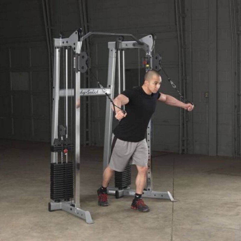 Body-Solid Compact Functional Training Center GDCC210 -man on  high pull cable crossover workout 