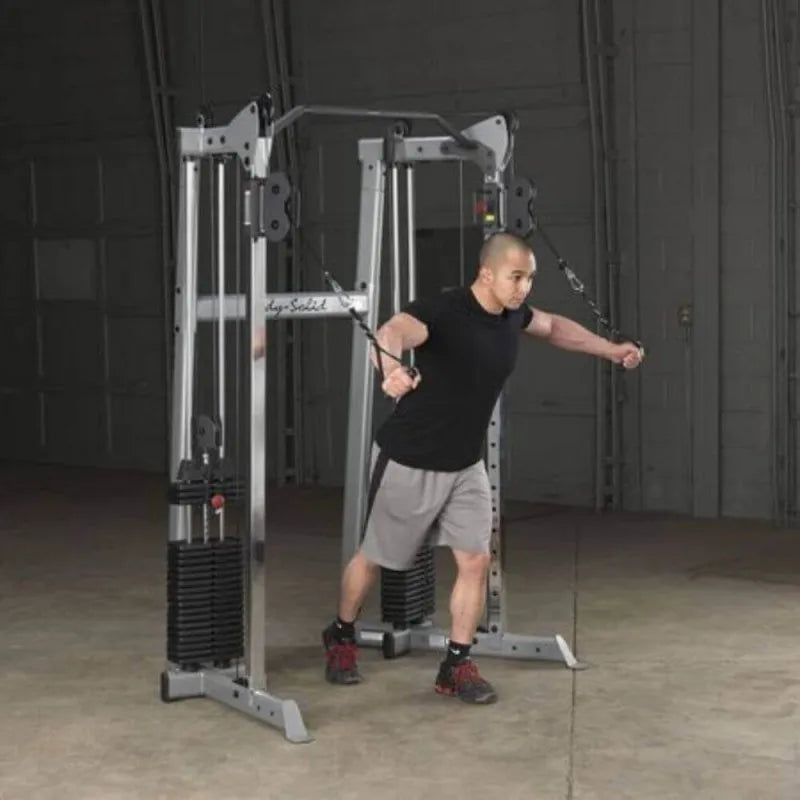 Body-Solid Compact Functional Training Center GDCC210 -man on  high pull cable crossover workout 