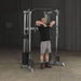 Body-Solid Compact Functional Training Center GDCC210 - Man on a upright row workout