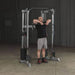 Body-Solid Compact Functional Training Center GDCC210 - Man on a upright row workout