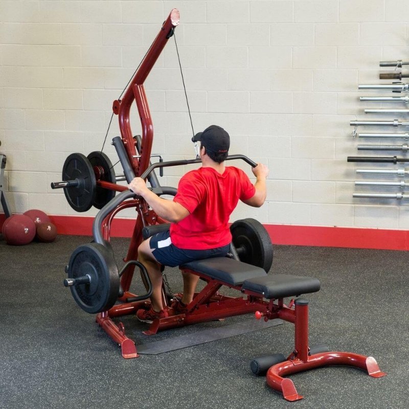 Body-Solid Corner Leverage Gym GLGS100 - man holding lat bar down