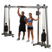 Body-Solid Deluxe Cable Crossover GDCC250 - Man and woman standing with the product