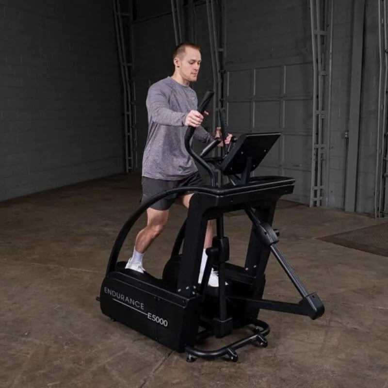 Body-Solid Endurance Center Drive Elliptical E5000 - Man doing exercise on the equipment
