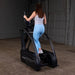 Body-Solid Endurance Center Drive Elliptical E5000 - back photo of the woman working out 
