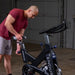 Body-Solid Endurance Spin Bike ESB250 - man adjusting the seat