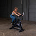 Body-Solid Endurance Spin Bike ESB250 - woman on training using bike in black color