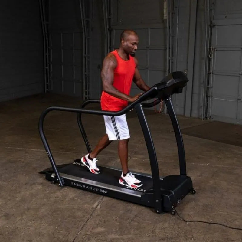 Body-Solid Endurance Walking Treadmill T50 - Man walking in the treadmill 