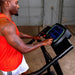 Body-Solid Endurance Walking Treadmill T50 - side view photo of man looking and pushing button son screen  display
