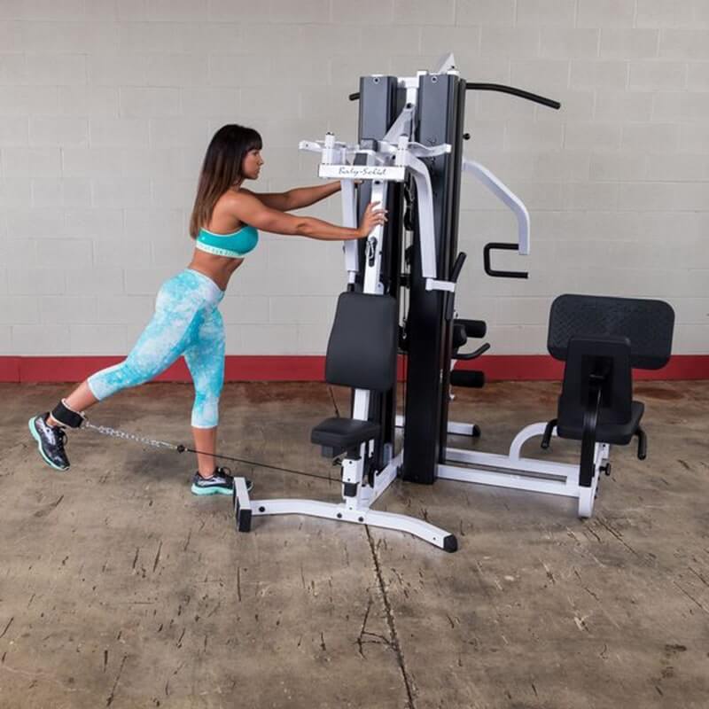 Body-Solid EXM3000LPS Multi-Stack Home Gym - Woman on kickback excercise