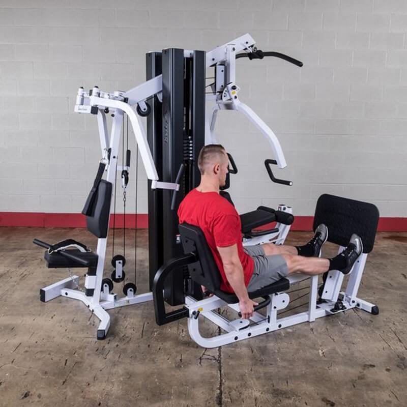 Body-Solid EXM3000LPS Multi-Stack Home Gym -  Man working out on Calf  raise