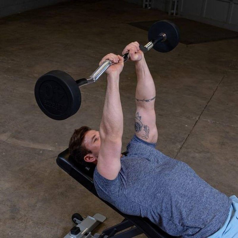 Body-Solid Fixed Curl Bar Sets - Man fully lift the barbell